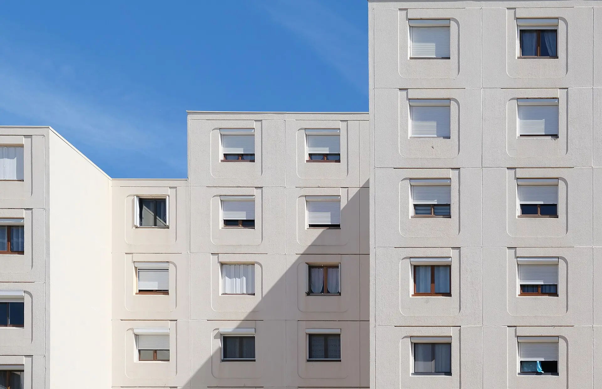 White apartment block with square windows