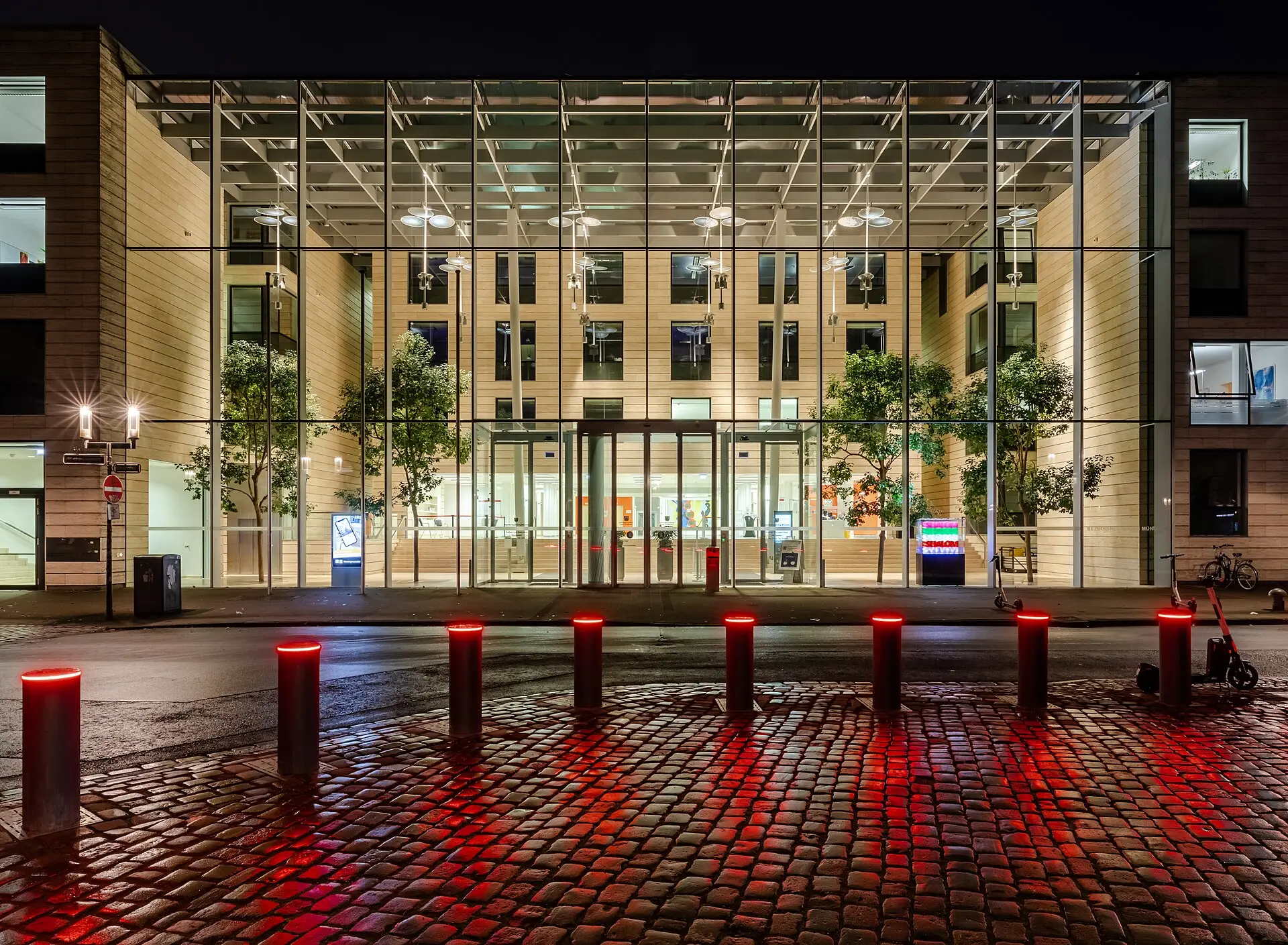 Glass hotel entrance lit at night