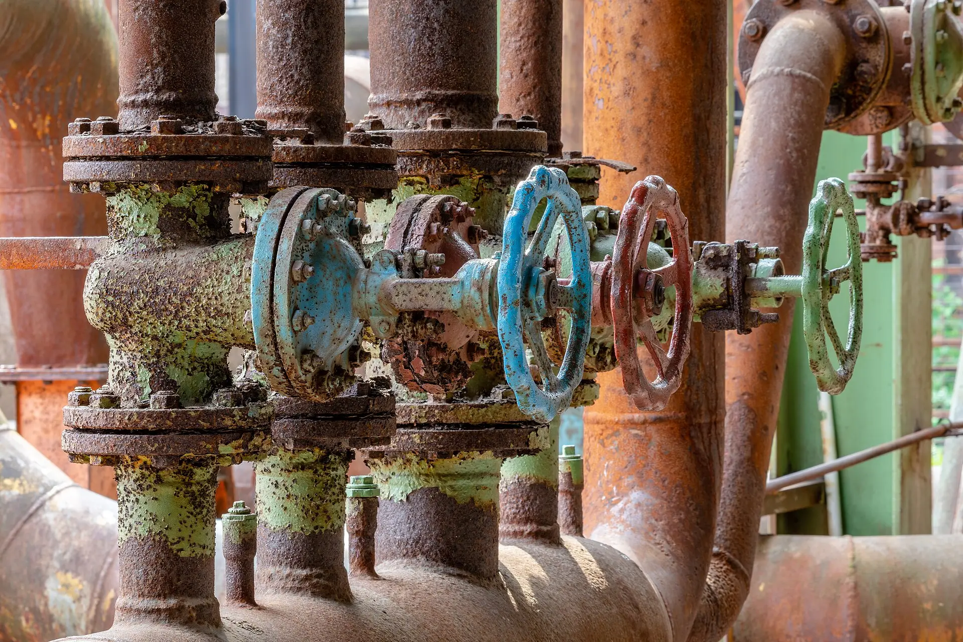 Valves and coloured pipework in an industrial plant room